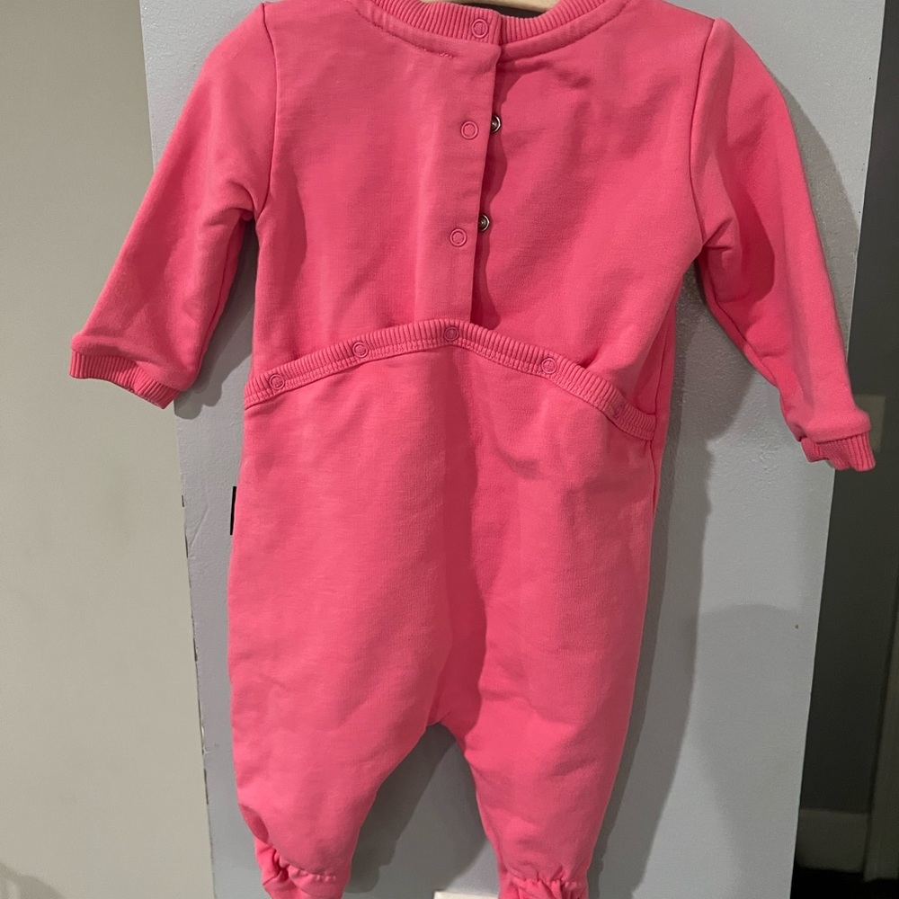 Baby girl lightly used Moschino onesie.